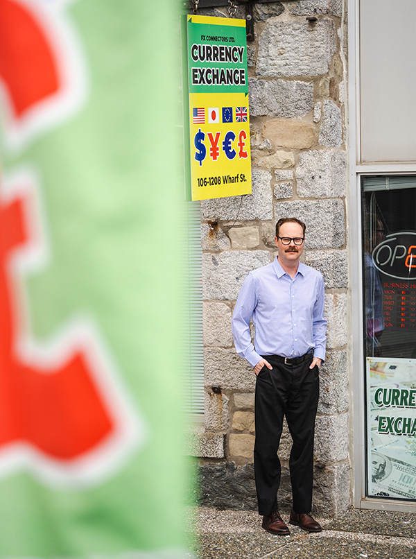 man standing in front of store